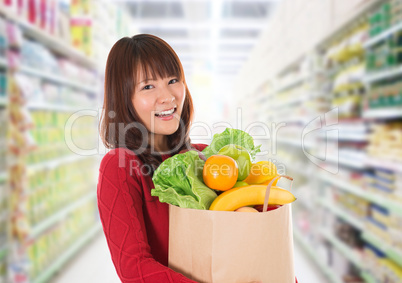 Asian woman shopping in a grocery store
