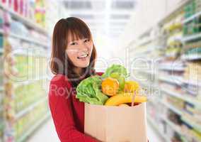 Asian woman shopping in a grocery store