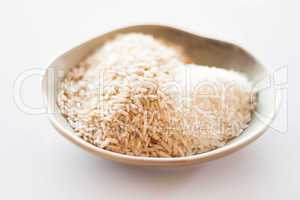 A mound of natural brown and white rice seeds