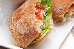 ciabatta panini sandwich with chicken and tomato