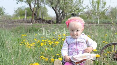 Cute baby on bicycle. Dolly shoot.