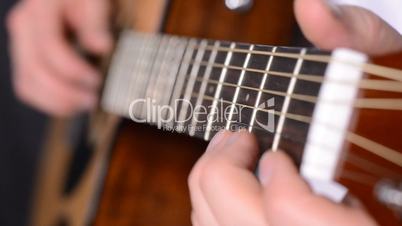man playing guitar close up