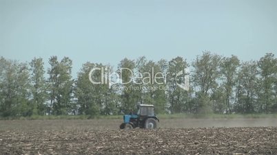 tractor in the field work the land