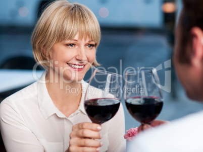 Couple toasting in a restaurant