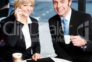 Two business professionals at coffee shop