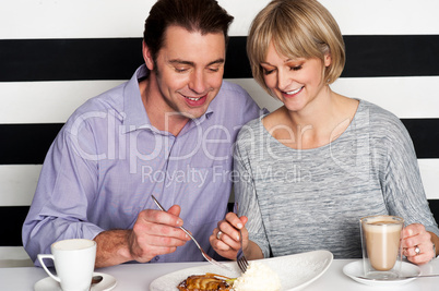 Beautiful couple having morning meal together