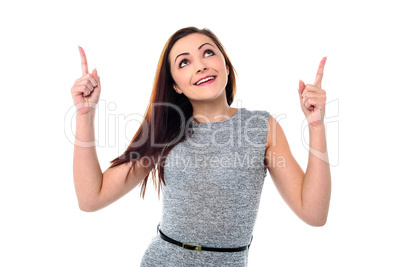 Amused young girl in sleeveless dress