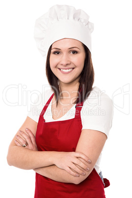 Cheerful confident young female chef