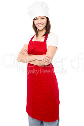 Young baker woman with folded arms