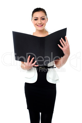 Fashionable businesswoman reviewing a file