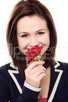 Lovely young girl with a beautiful red rose