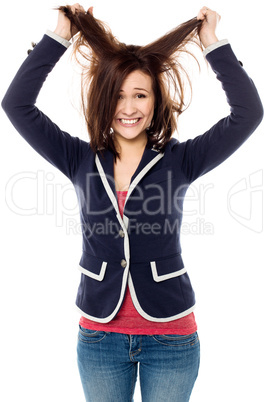 Young girl pulling her hair in excitement