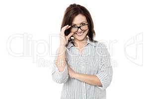 Cute woman adjusting her eyewear