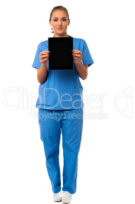 Pretty doctor showcasing a portable tablet