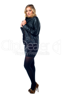Attractive young female model in leather jacket