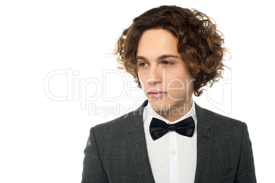 Sullen faced serious young groom