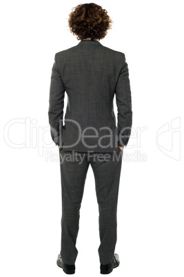 Back pose of a man in gray formals