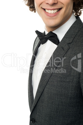 Groom in pose against white background