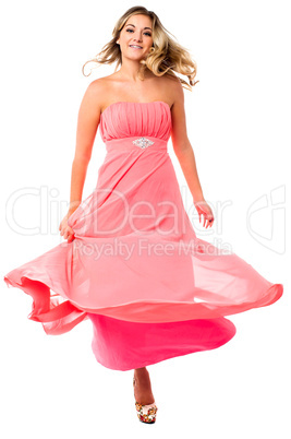 Sexy woman dancing and swirling in party dress