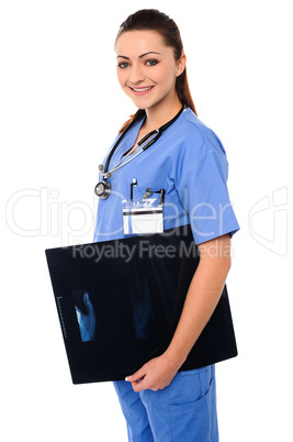 Attractive doctor holding x-ray report