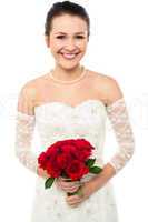 Gorgeous pretty bride with a rose bouquet