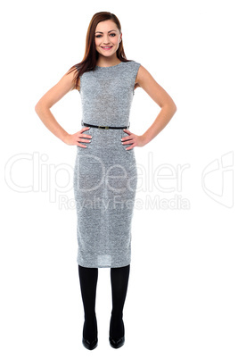Stylish young woman with hands on waist