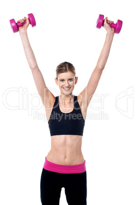 Female instructor showing how to lift dumbbells