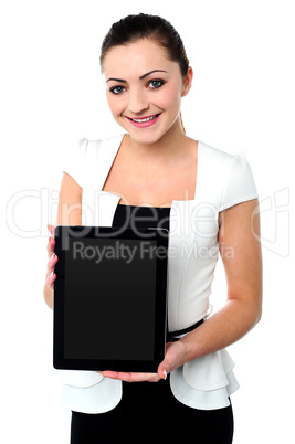 Pretty young girl showcasing a tablet device
