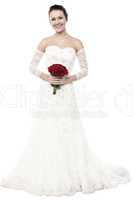 Gorgeous bride holding a rose bouquet
