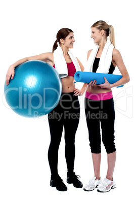 Two girls communicating after workout