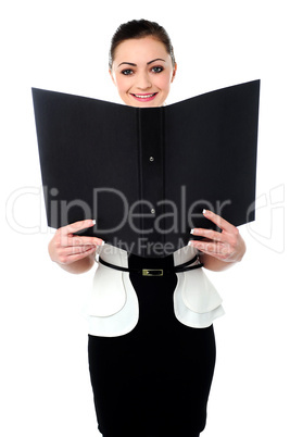 Cheerful woman looking at the file in hands