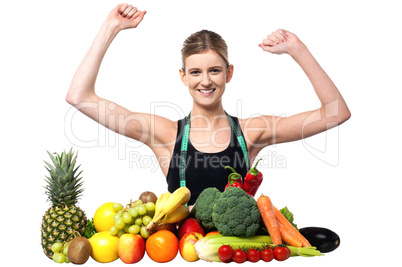 Happy teenager with fruits and vegetables