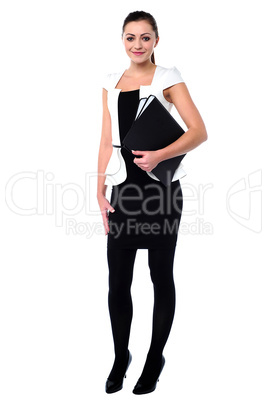 Young corporate woman holding files