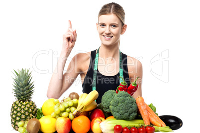 Pretty slim girl with fruits and vegetables