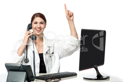 Female physician answering phone call
