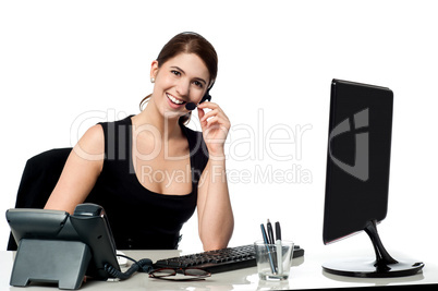 Female executive assisting client over a call