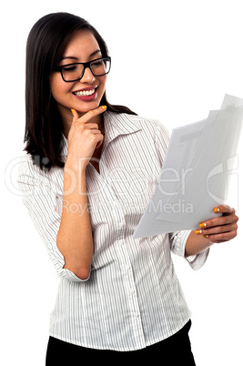 Female analyzing annual business reports