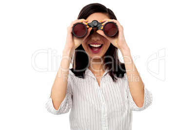 Businesswoman enjoying view through binoculars