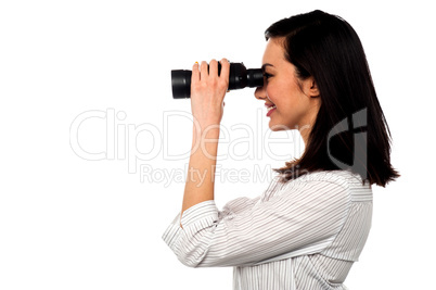Corporate woman viewing through binoculars