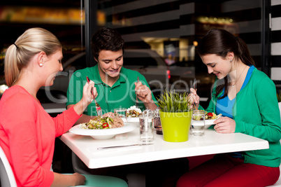 Family enjoying meal outdoors