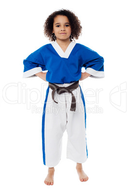 Young confident karate kid posing