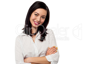 Female secretary posing with arms crossed