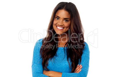 Young girl posing with her arms crossed