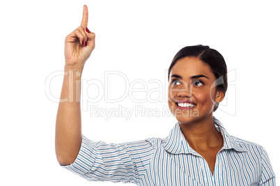 Corporate woman pointing upwards