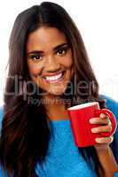 Smiling woman with coffee mug