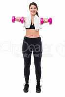 Fitness trainer holding dumbbells, arms outstretched