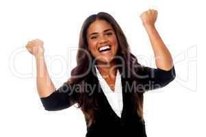 Excited woman with clenched fists