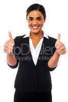 Attractive woman showing double thumbs up