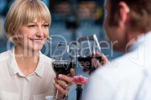 Couple toasting in a restaurant