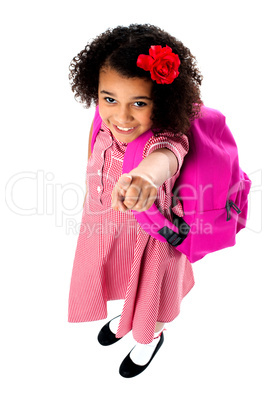 Aerial view of cute girl pointing upwards